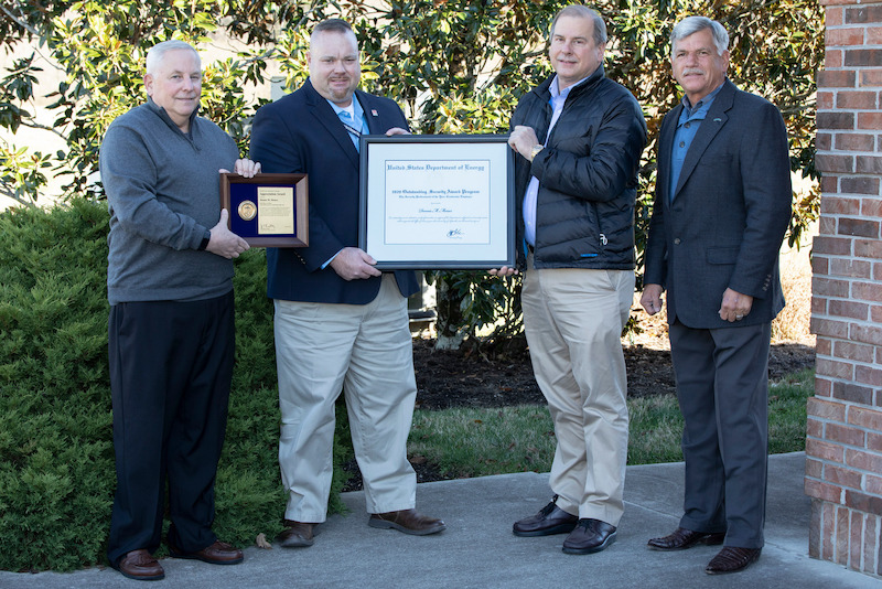 Dennis Mosser, physical security manager for the Oak Ridge Institute for Science and Education. Also pictured: ORAU President and CEO Andy Page, ORISE Security Director Tom Amidon, and DOE Oak Ridge National Laboratory Site Office Manager Johnny Moore.