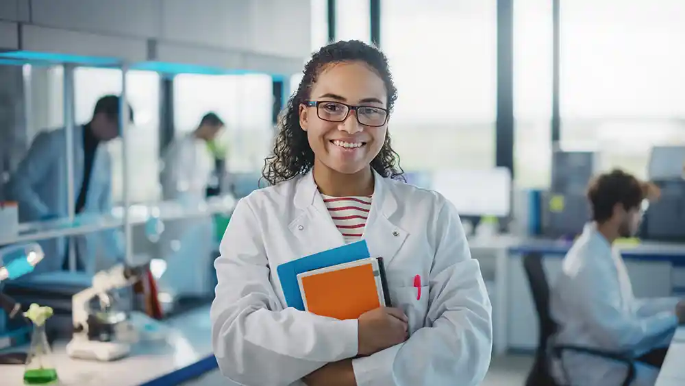 young african female grad student in a lab setting