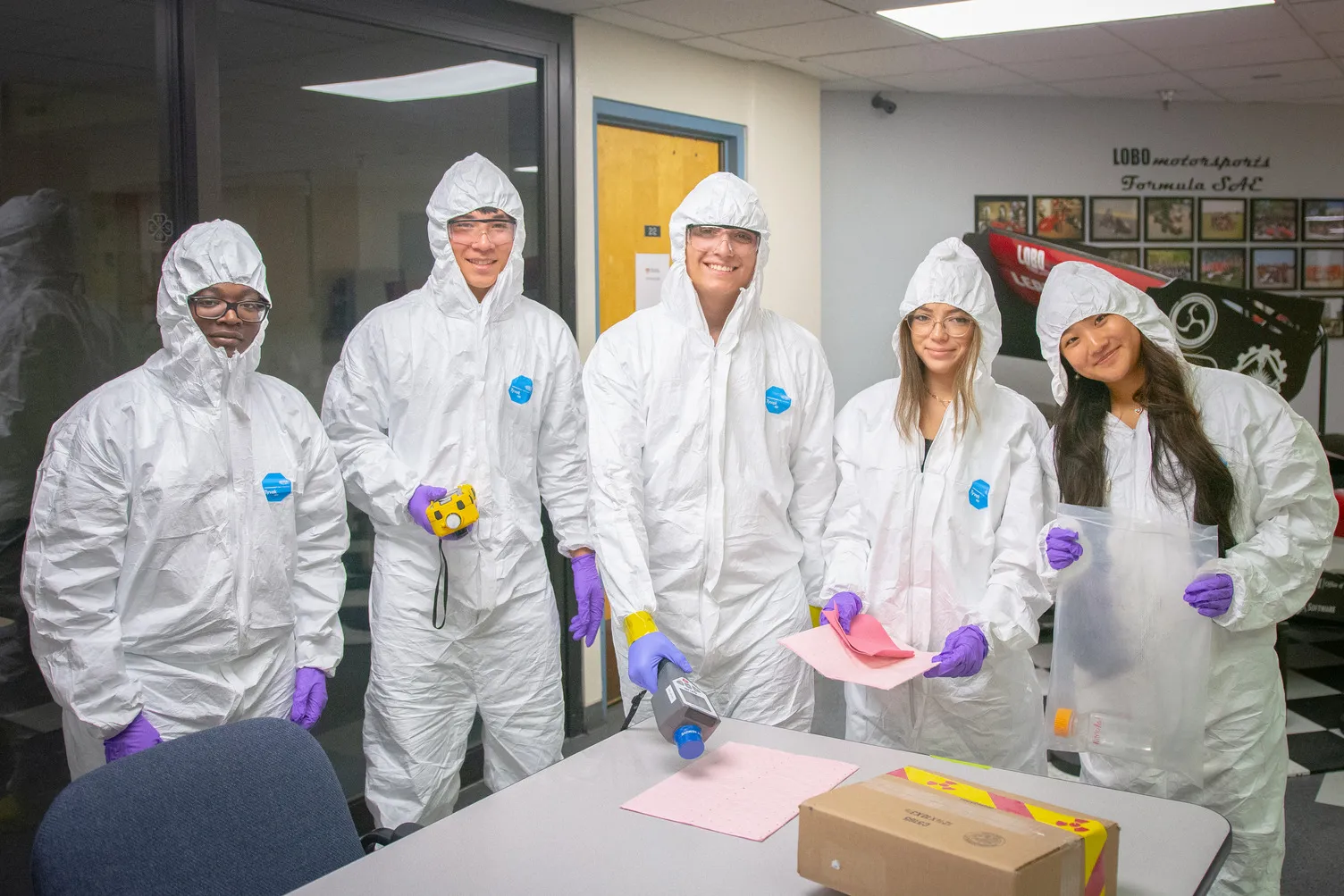 Students conduct research in a lab during the Joint Science and Technology Institute at Albuquerque