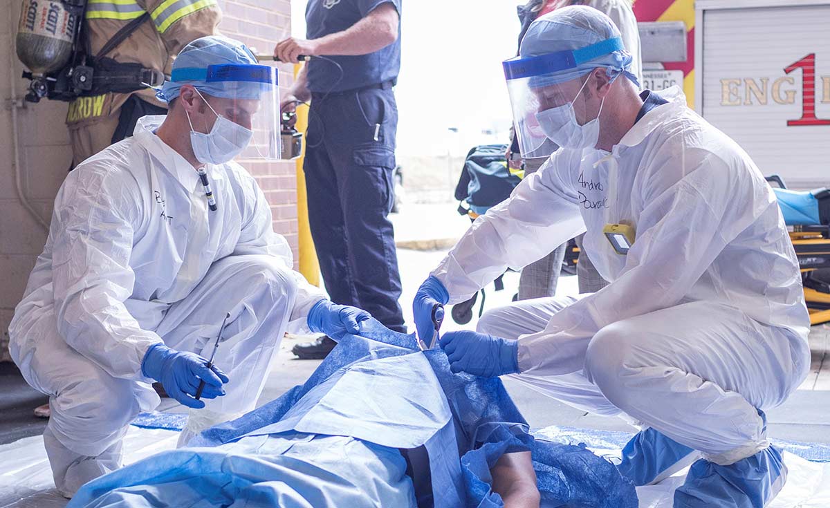 First responders preparing patient for transport