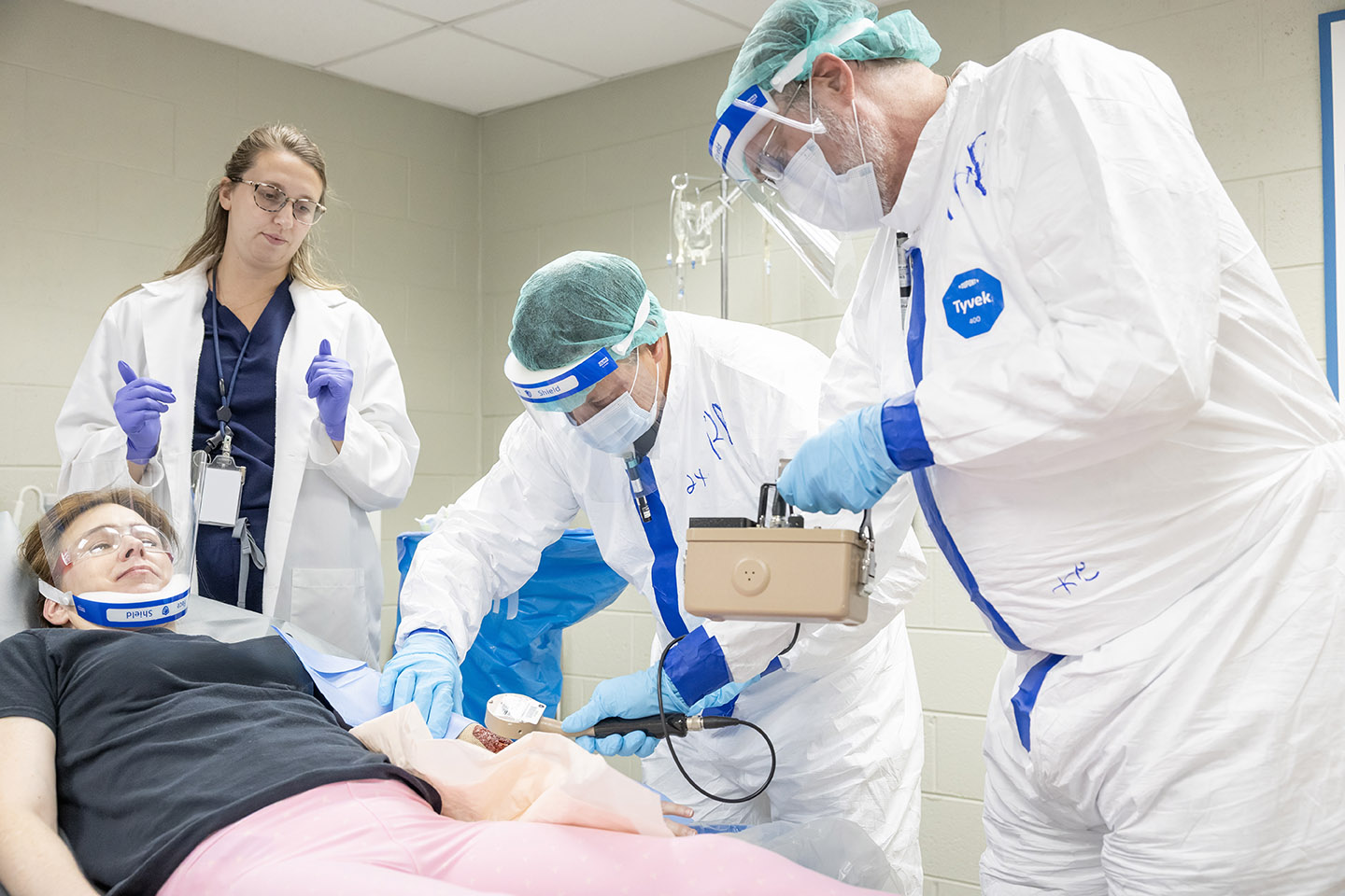 Participants survey a patient during the REAC/TS Health Physics in Radiation Emergencies course