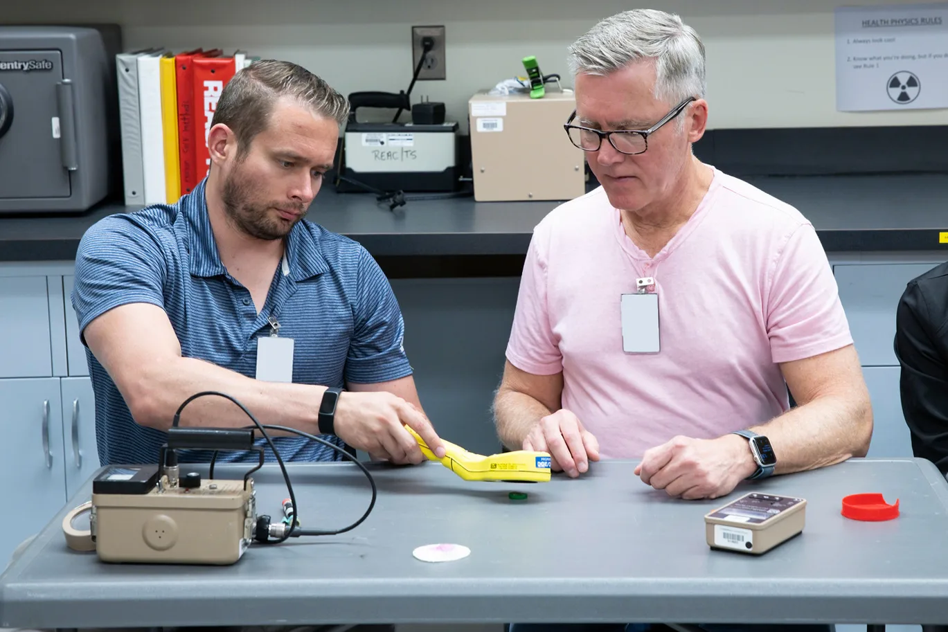 Medical professionals scan a radiation source during a REAC/TS Continuing Medical Education course