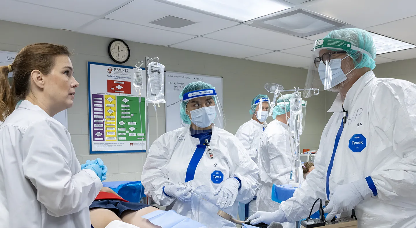 REAC/TS staff assist students during a Radiation Emergency Medicine course