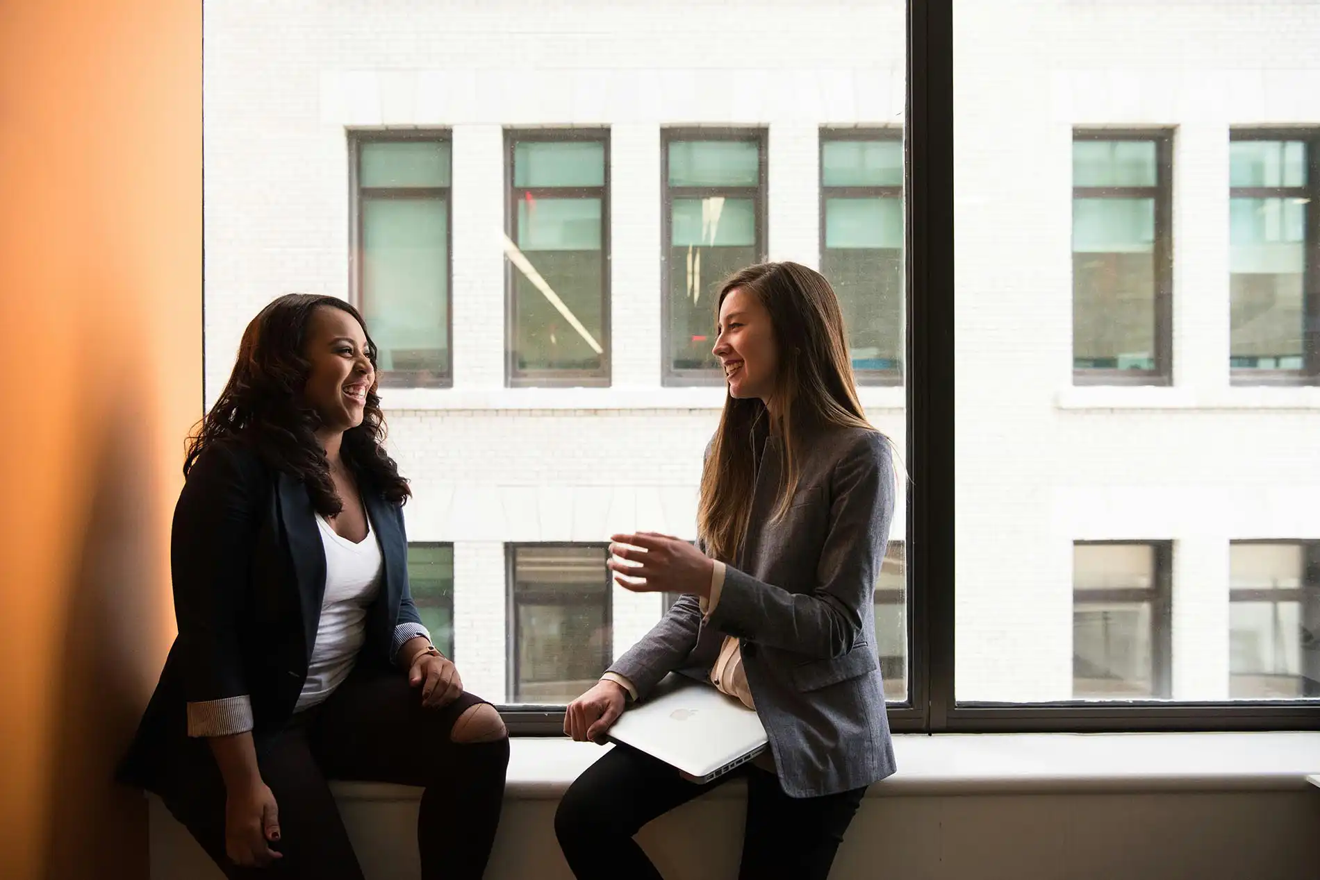 Two women casually in conversation 