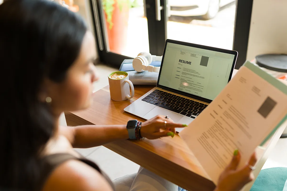 Young woman working on her resume