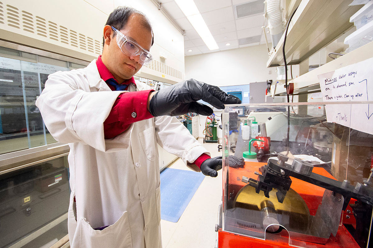 Male postdoctoral student conducting laboratory research