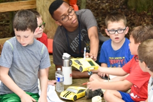 JSTI alumni and current participants help out on a Boys and Girls Club outing at Camp Hidden Valley