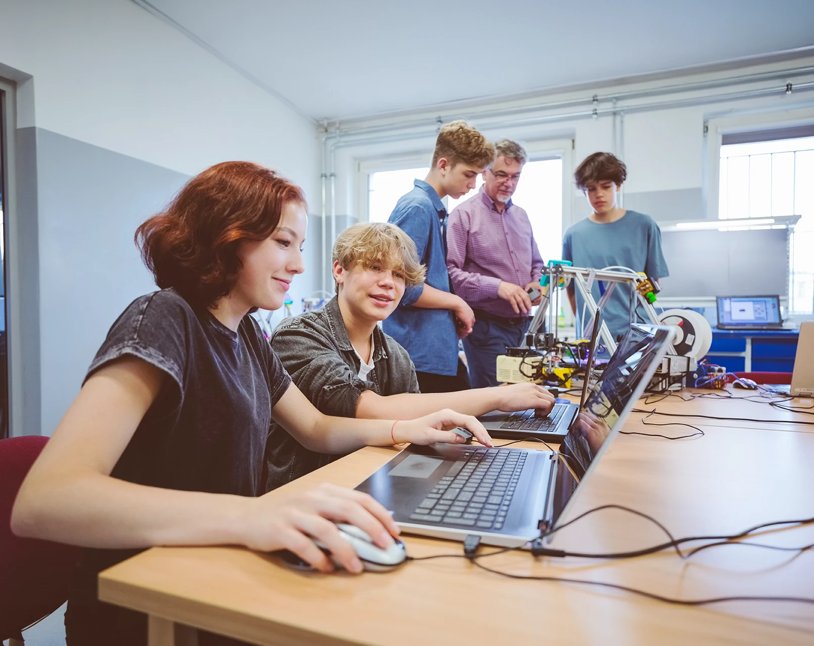 High school students learning coding 