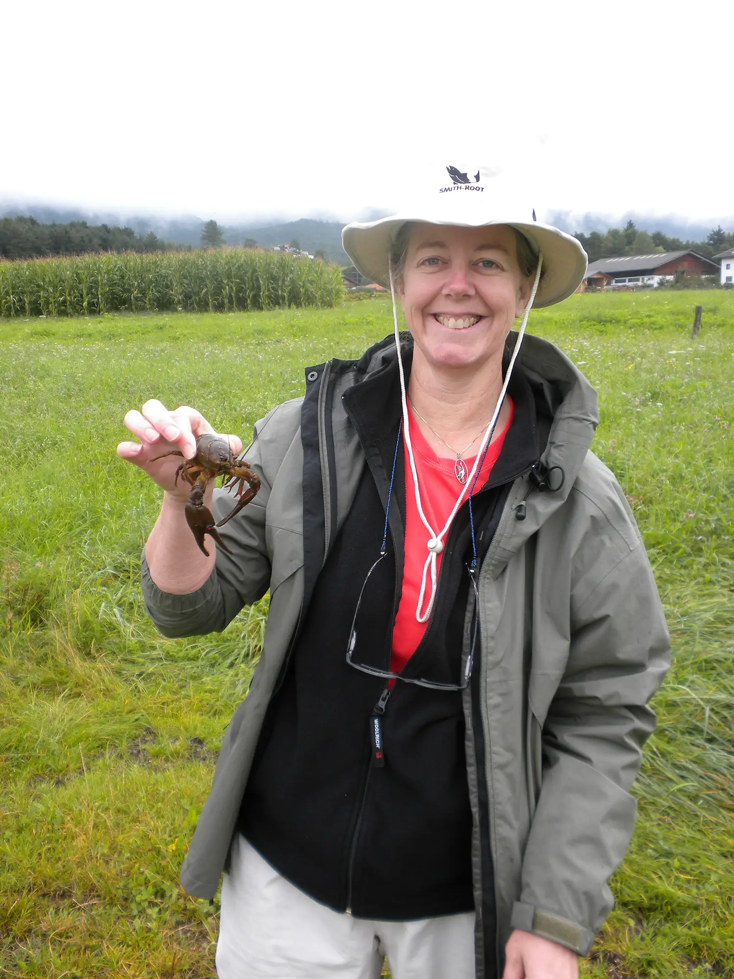 Adams holding a crayfish in Austria while on a field trip at an International Association of Astacology (study of crayfish) conference. (Photo credit: Susan B. Adams)